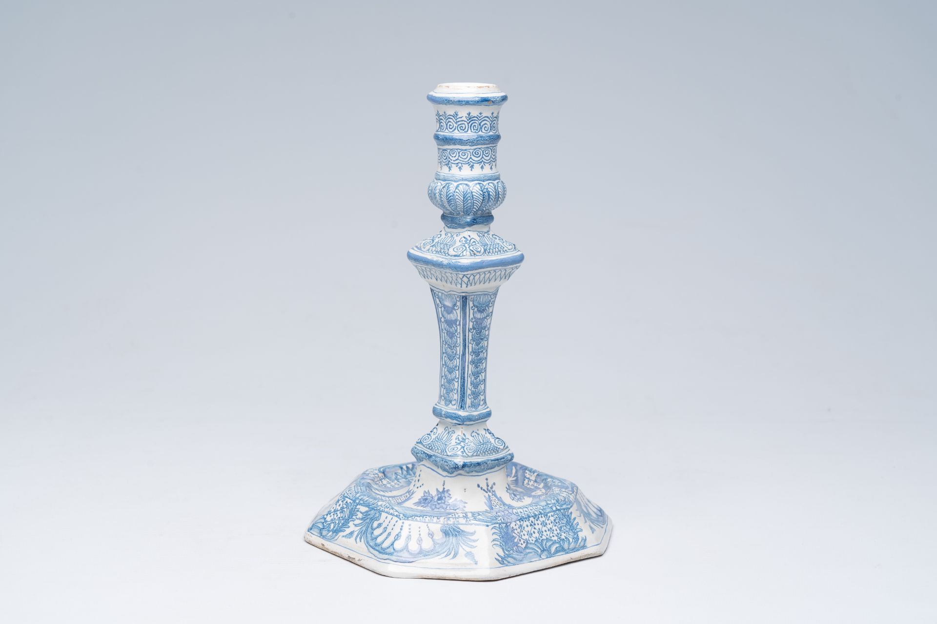 A German blue and white richly decorated earthenware candlestick, Nuremberg, 18th C.