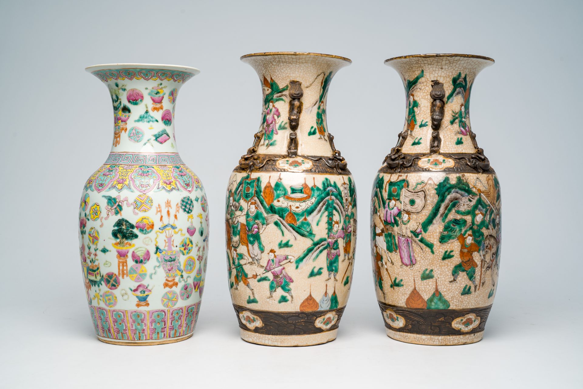 Two Chinese Nanking crackle glazed famille rose 'warrior' vases and an 'antiquities' vase, 19th C. - Image 5 of 7