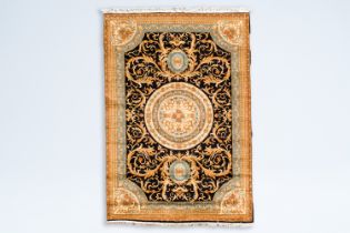 A Savonnerie style rug with floral design, wool on cotton, 20th C.