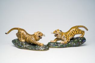 A pair of Chinese cloisonne models of prowling tigers, 20th C.