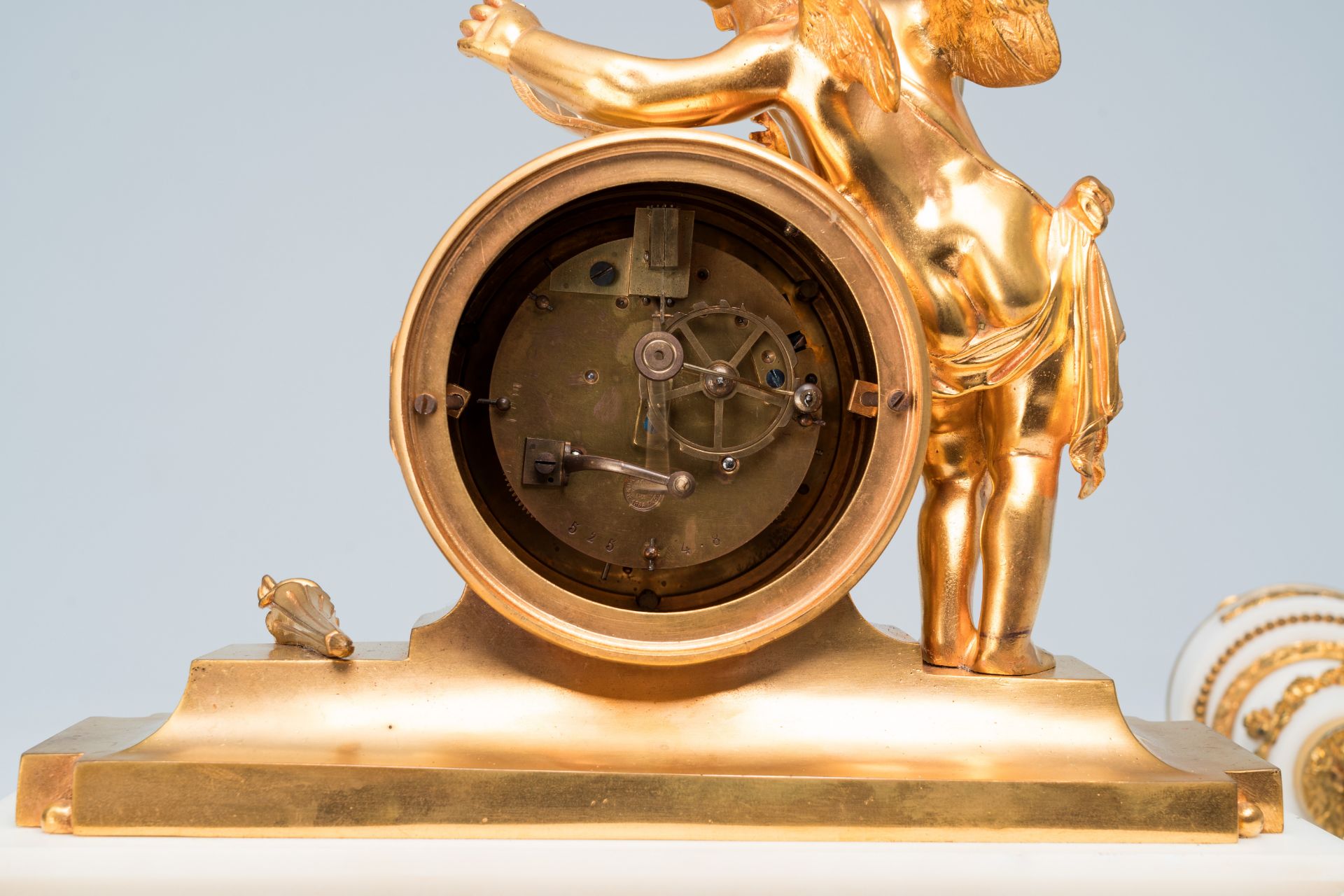 A French gilt bronze mounted white marble three-piece clock garniture with putti, 19th C. - Image 4 of 33