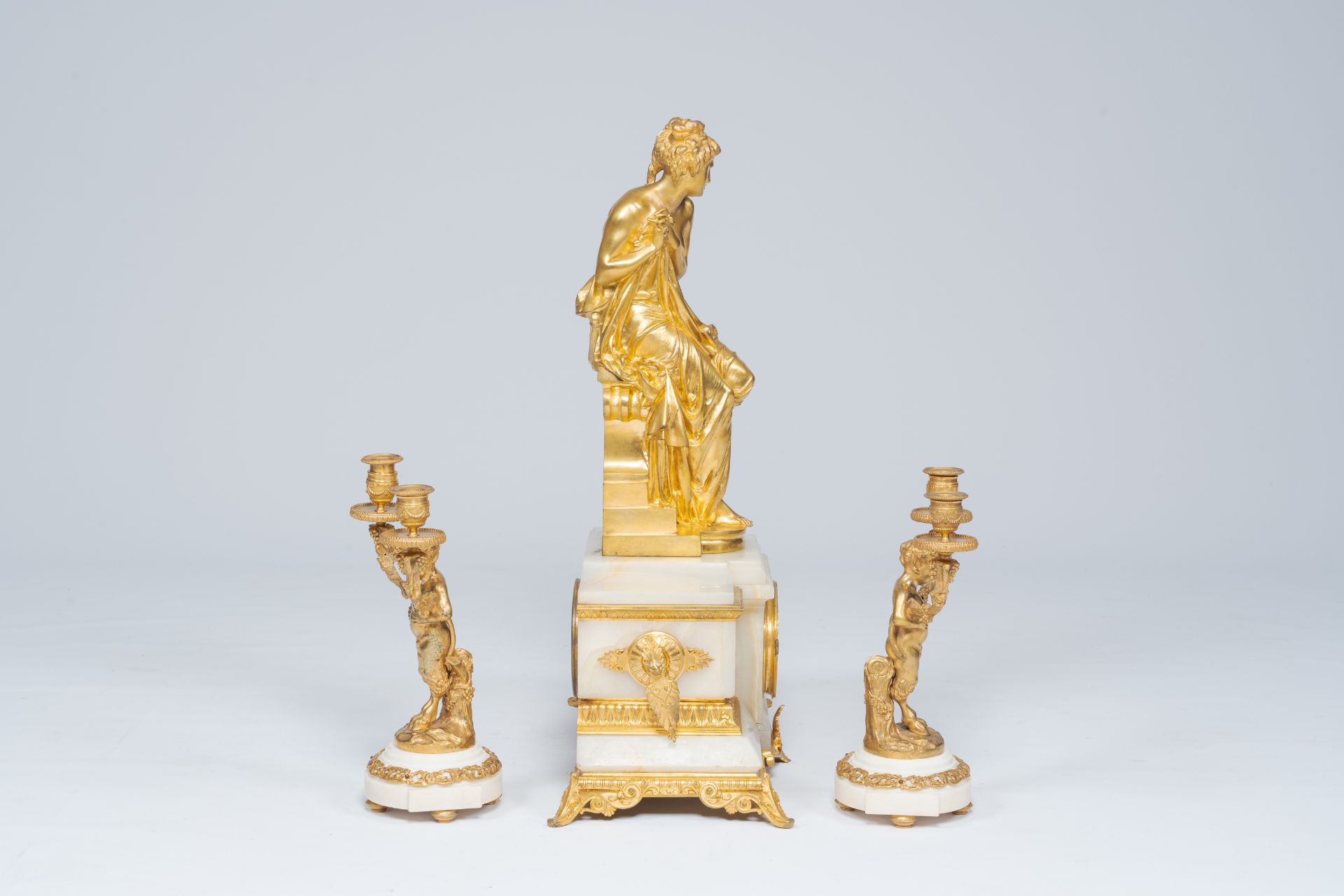 A French gilt bronze mounted marble and alabaster three-piece clock garniture with Susanna and satyr - Image 2 of 7