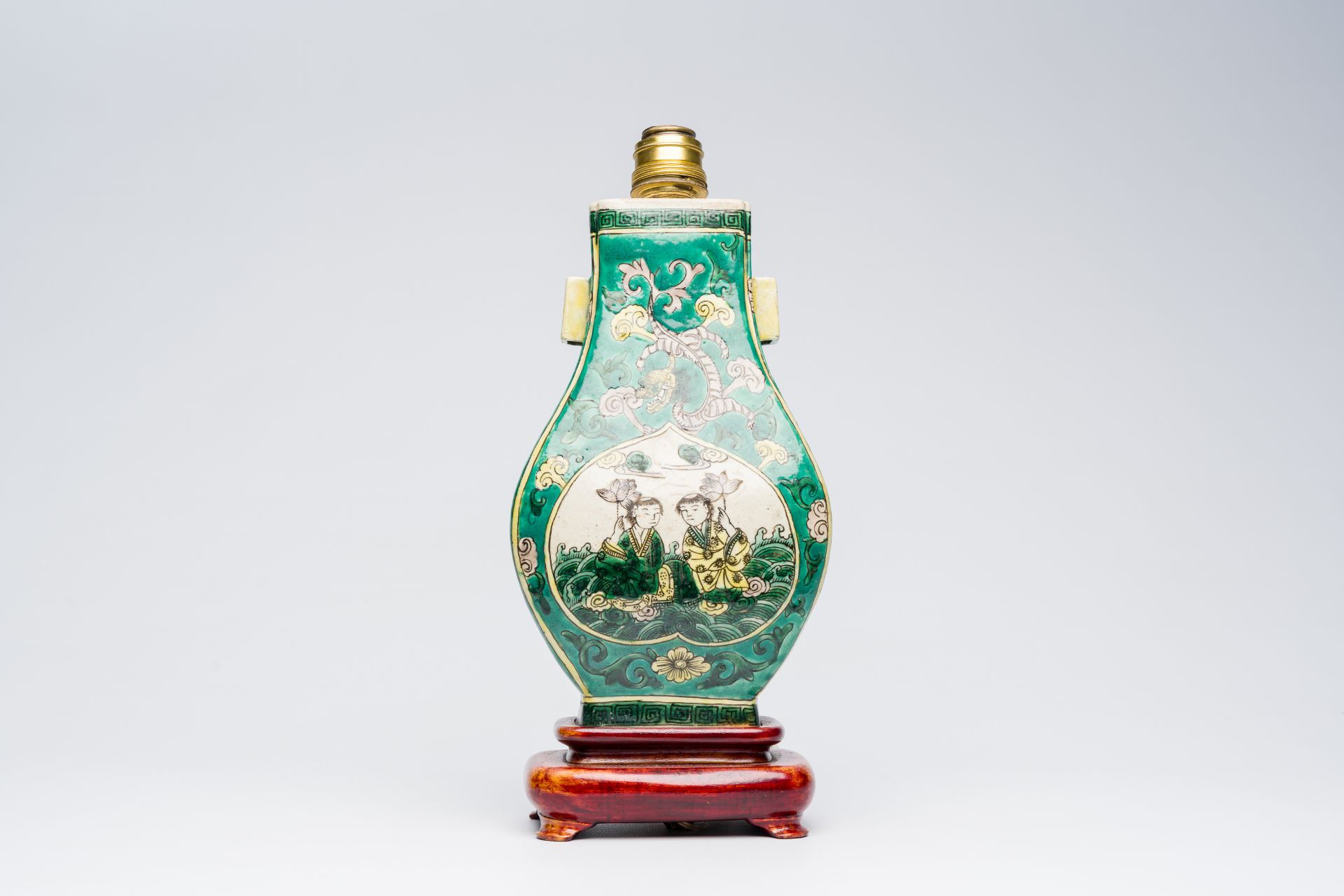 A Chinese verte biscuit 'fanghu' vase with two boys mounted as a lamp, 19th C. - Image 4 of 7