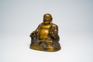 A Chinese bronze figure of a seated Buddha, 16th/17th C.