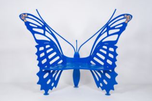 Olivier De Schrijver (1958): A monochrome blue wrought iron butterfly-shaped garden bench with orang