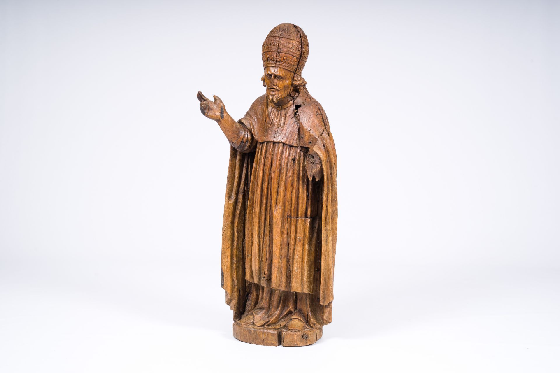 A carved wood blessing figure with papal tiara, 17th/18th C.
