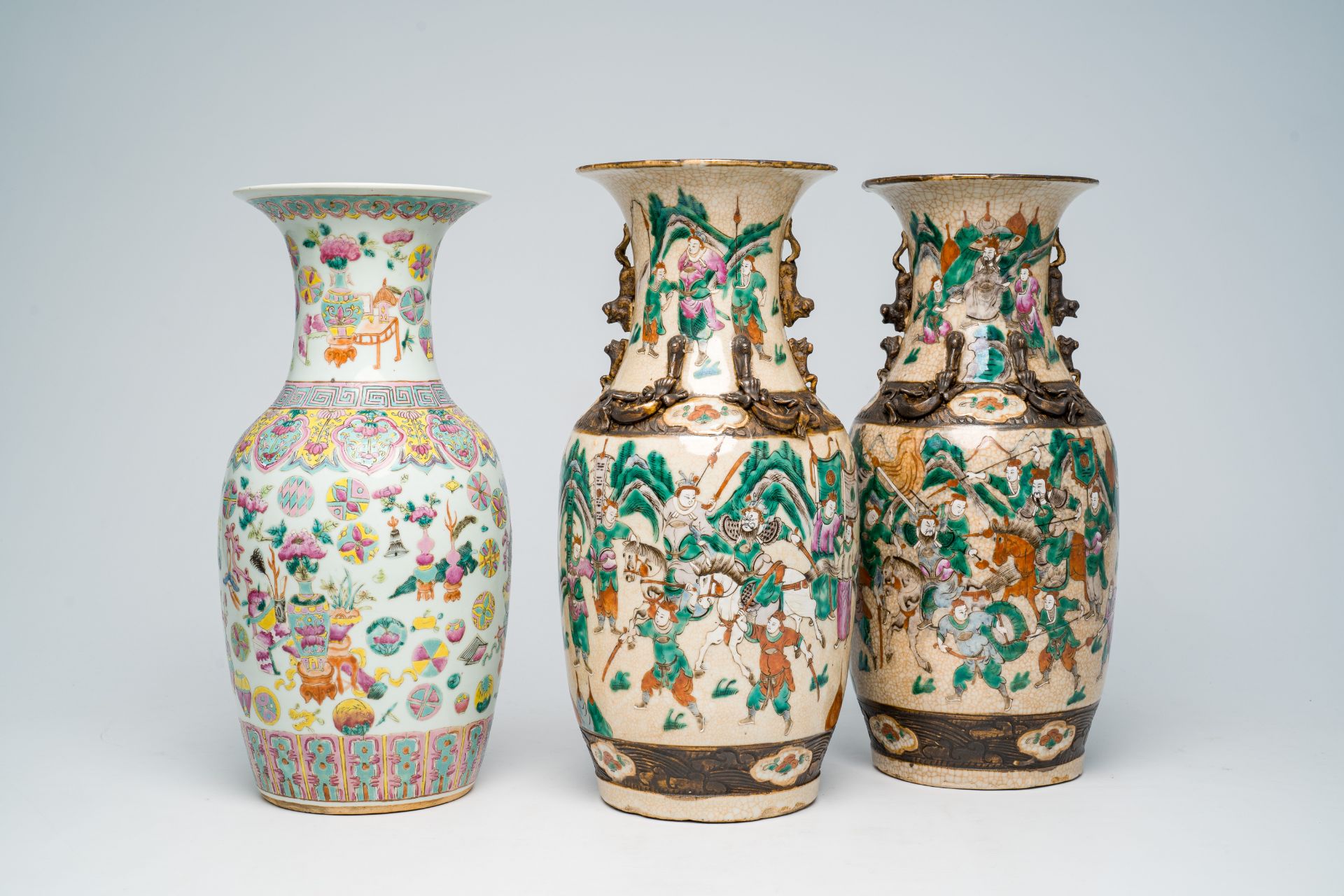 Two Chinese Nanking crackle glazed famille rose 'warrior' vases and an 'antiquities' vase, 19th C.