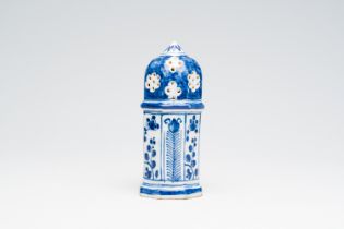 A Dutch Delft blue and white caster with floral design, 18th C.