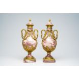 A pair of French bronze mounted Empire style marble cassolettes wit swan necks and floral design, 19