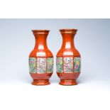 A pair of Chinese famille rose coral-red ground vases with birds among blossoming branches, Qianlong