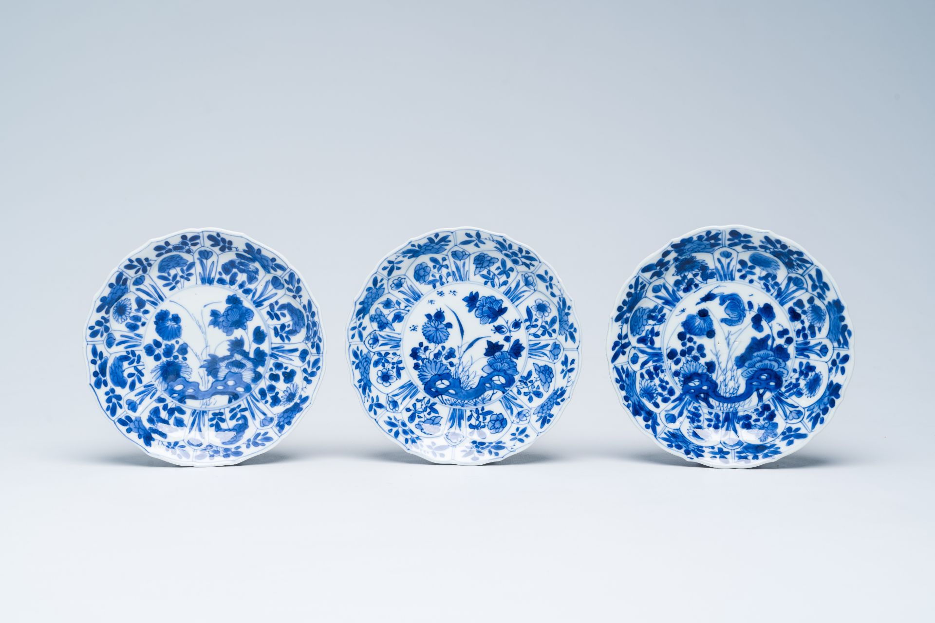 Six Chinese blue and white saucers with floral design, Kangxi - Image 4 of 5
