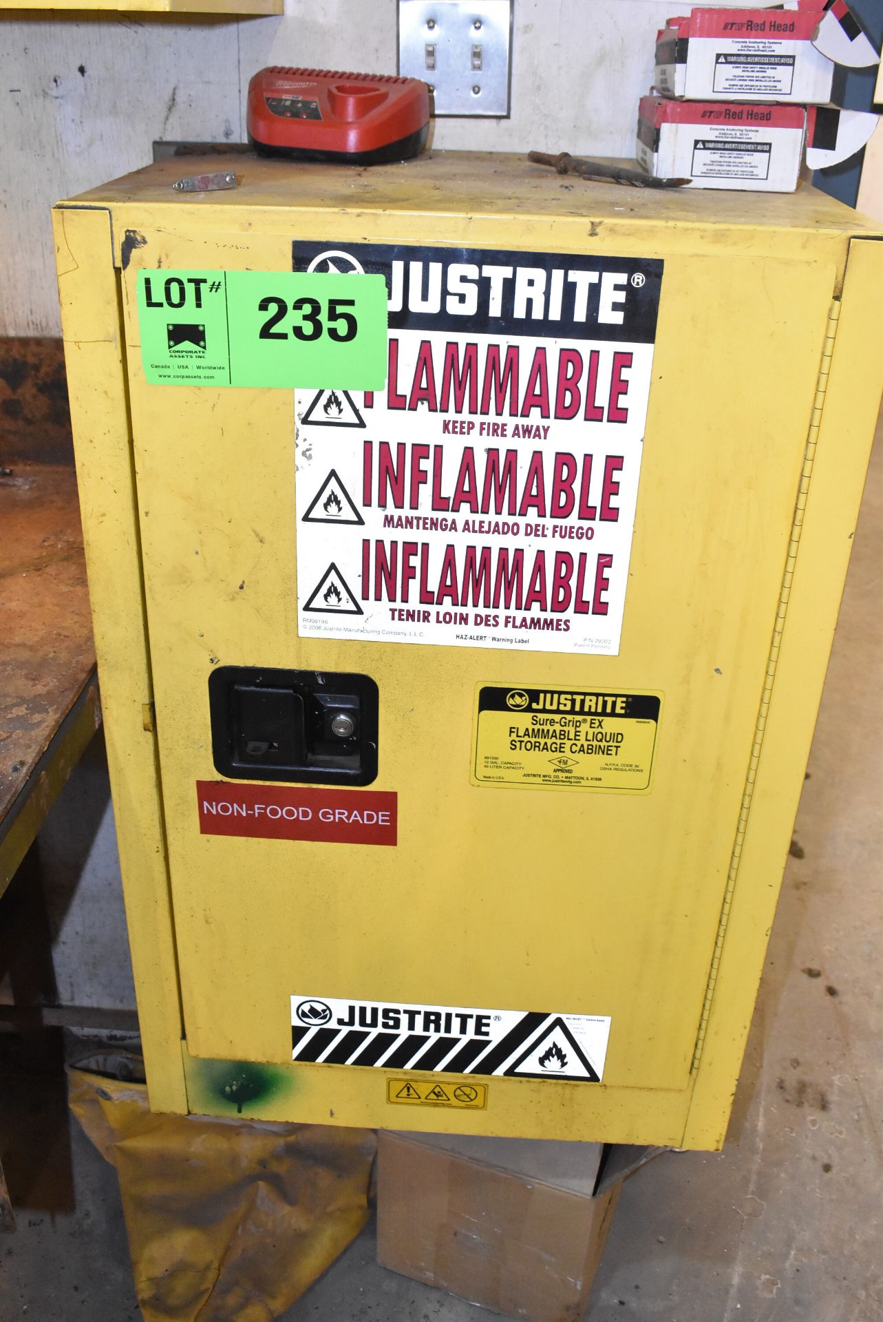 JUSTRITE FLAMMABLE STORAGE CABINET WITH CONTENTS [RIGGING FEE FOR LOT #235 - $50 CAD PLUS APPLICABLE