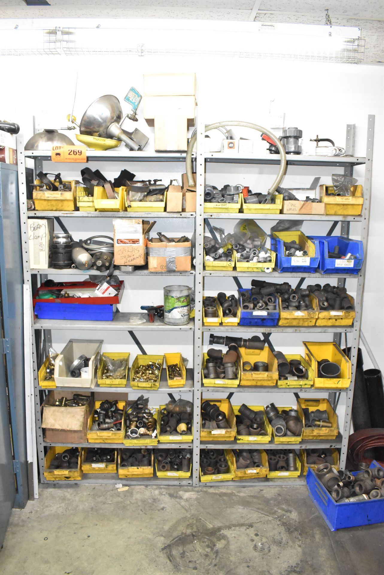 LOT/ (2) SECTIONS OF STEEL SHELVES WITH CONTENTS - INCLUDING PIPE FITTING, ELBOWS, PVC FITTINGS,