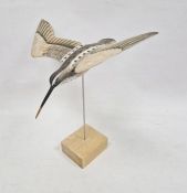 Carved and painted wooden model snipe in flight, on stand