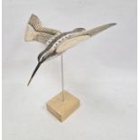 Carved and painted wooden model snipe in flight, on stand