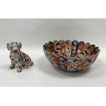 Japanese imari bowl, 27cm in diameter, a vase, and a floral painted model of a dog, 13cm high (3)