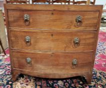 Late 19th/early 20th century bowfront mahogany chest of drawers having three long drawers, each with
