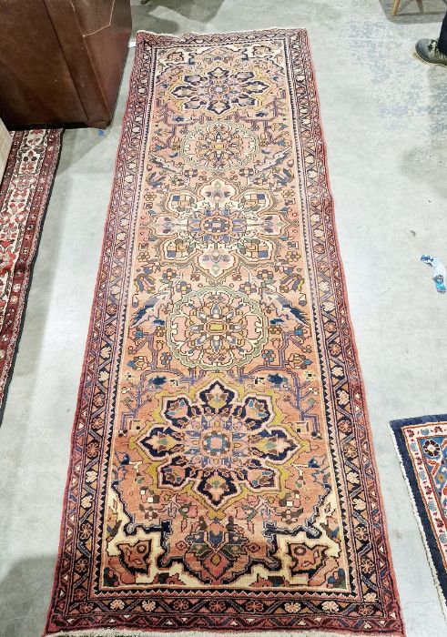 North West Persian Heriz orange ground runner with one row of five floral medallion on a floral - Image 2 of 2