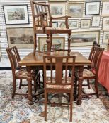 A twentieth century mahogany extending dining table together with five similar dining chairs, one of