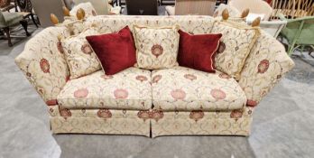 Knole drop-end sofa by Brights of Nettlebed, upholstered in a floral scrolling fabric on a cream