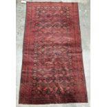 North East Persian red ground Turkoman rug with repeating geometric pattern, multiple geometric