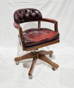 Contemporary captain's swivel armchair, 84cm high Condition ReportNumerous scratches and scuffs to