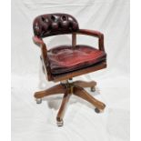 Contemporary captain's swivel armchair, 84cm high Condition ReportNumerous scratches and scuffs to