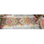 Chobi kilim cream ground runner with one row of  five stepped lozenge medallions to a geometric