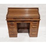 Early 20th century oak roll top desk, 103cm high x 120cm wide x 64cm deep