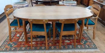 1969/1970 Oliver Morel Cotswold School walnut oval dining table and chairs, the table having figured