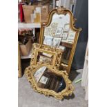 Three gilt framed wall mirrors, one having bevelled edge glass panel and ornately pierced and carved