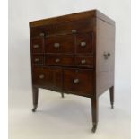 Georgian mahogany campaign writing/vanity cabinet, the lift-up top revealing compartments and