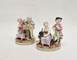 Pair of Meissen-style porcelain groups of children, one group with bird and cage, floral garland and