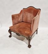 19th century mahogany armchair with gadrooned arched top, decorated in a pink velvet upholstery,