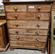 Victorian flame mahogany chest on chest comprising two short over five long drawers, with turned
