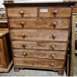 Victorian flame mahogany chest on chest comprising two short over five long drawers, with turned