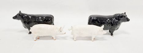 Two Beswick models of Aberdeen Angus bulls, a Beswick model of a pig inscribed "Wall Queen" to