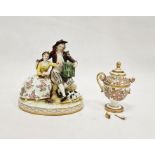 Dresden porcelain group of two rustic figures with bird in cage, oval base, 16cm high and a