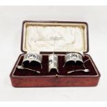 Silver three-piece condiment set, each with gallery sides, on scroll tab feet, having blue glass