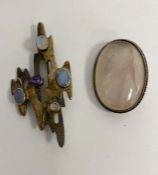 Modern silver brooch set with opals and other gemstones and an oval quartz set brooch (2)