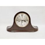 Early 20th century mahogany-cased Napoleon-hat shaped mantel clock, the circular silver dial with