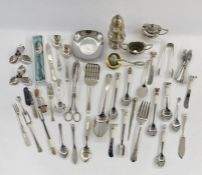 Assorted silver-plated items to include cruet set, sugar tongs, sugar shaker, jam spoons, dessert