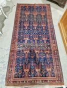 North East Persian blue ground Meshed Belouch rug with repeating geometric and stylized animal