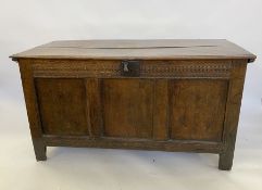 Large antique oak coffer having quadrant mould edge, scroll carved frieze, triple framed panel