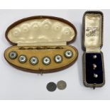 Three gold and pearl studs, cased, 3g approx. and a set of six gilt metal and enamel collar studs,