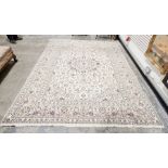 Central Persian Kashan cream ground carpet with central floral medallion on allover floral field and