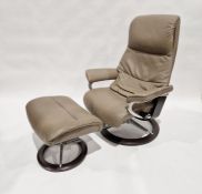 Contemporary, Stressless-style armchair with matching footstool, the armchair measuring 110cm high