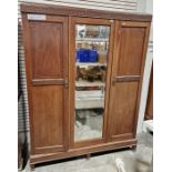 Early 20th century mahogany two-section wardrobe with two doors having carved geometric