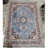 Modern blue ground rug with central herati motif on floral field and floral spandrels, multiple
