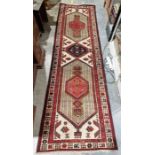 North West Persian Heriz cream ground runner with central lozenge medallion flanked by two larger